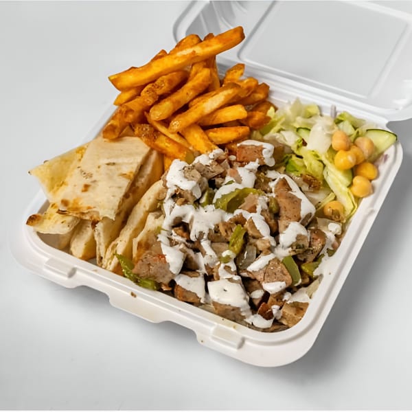 Halal Haven's chicken and lamb gyro platter with fries, pita bread, and salad in a takeout container.